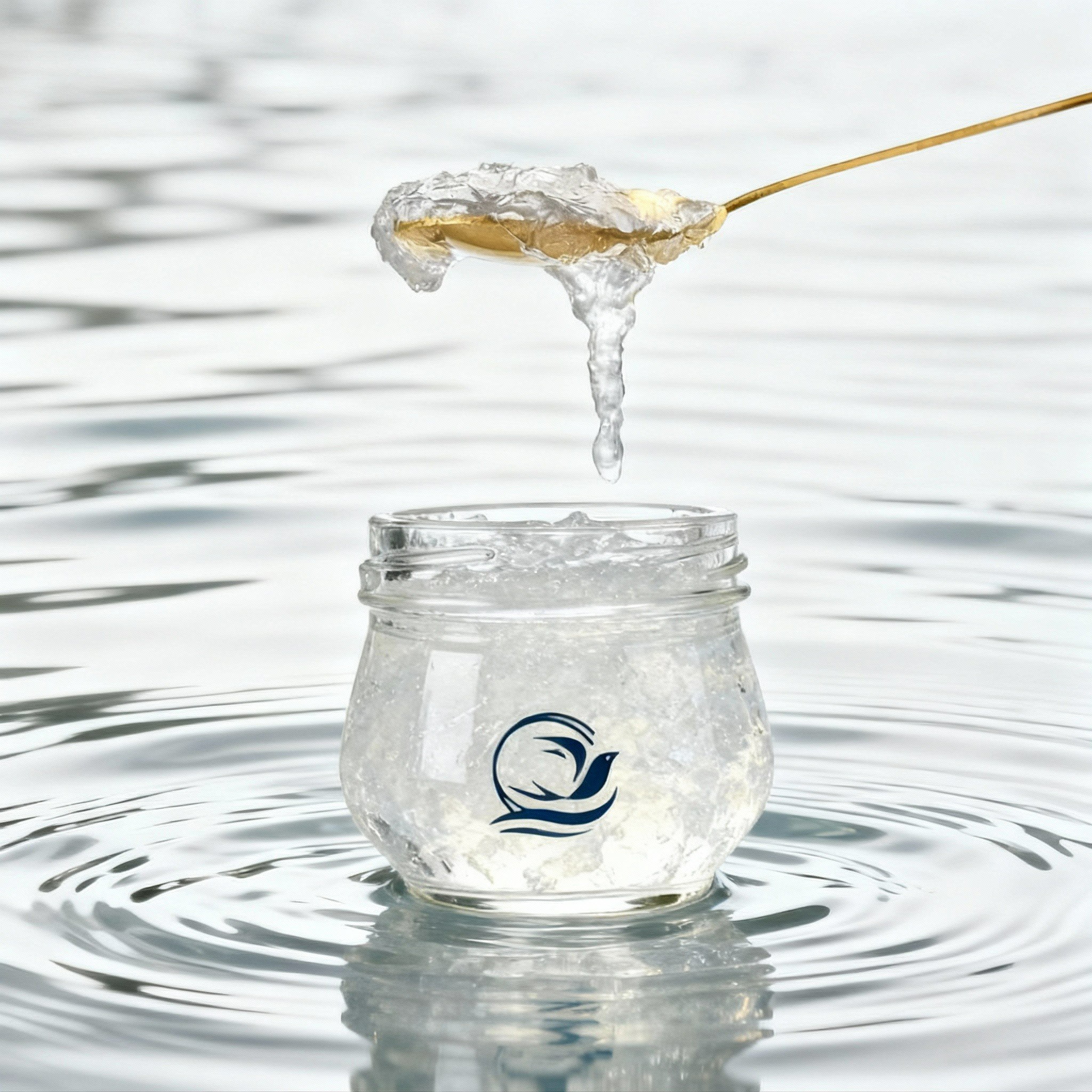 NIS NEST bird's nest spoon over a branded jar in rippling water.